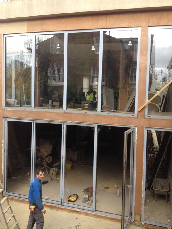 Aluminium bi-fold doors with two-storey glazing in Sydenham