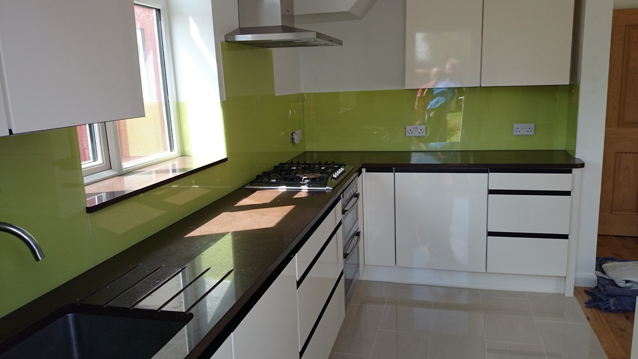 Lime green glass kitchen splashback installed by Sydenham glaziers